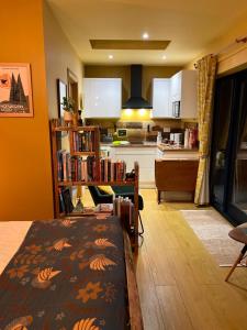 a kitchen and a living room with a dining room at The Vikings Retreat in Donington on Bain