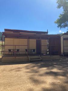 a building with two tables and chairs in it at Bright Cabin Park in Bright