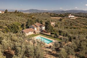 an aerial view of a villa with a swimming pool at Luxury Villa Acquaviva Firenze in Montauto