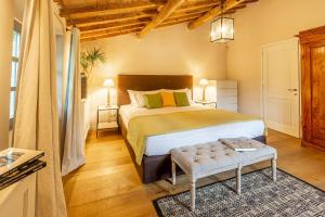 a bedroom with a large bed in a room at Luxury Villa Acquaviva Firenze in Montauto +40 photos