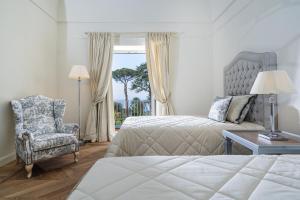 Postel nebo postele na pokoji v ubytování La Tuja Relais du Parc + 37 fotografií