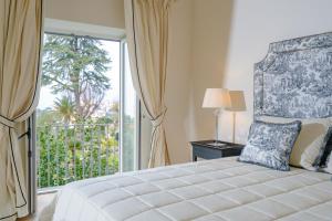 Postel nebo postele na pokoji v ubytování La Tuja Relais du Parc