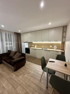 a living room with a couch and a table at Music Flats in Sofia