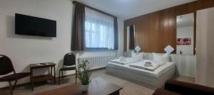 Postel nebo postele na pokoji v ubytování Central-Hotel Tegel