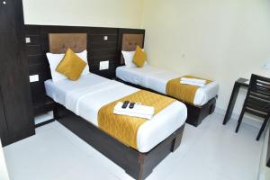 Postel nebo postele na pokoji v ubytování Hotel Embassy Suites
