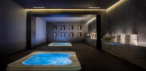 a jacuzzi tub in the middle of a room at Hotel Imperial - Liburnia in Opatija