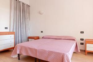 A bed or beds in a room at Villa Regno di Toscana