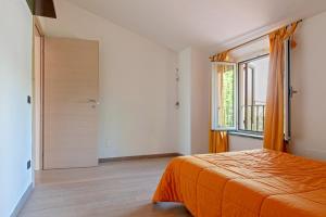 A bed or beds in a room at Villa Regno di Toscana
