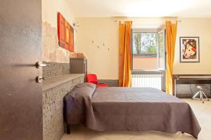 A bed or beds in a room at Villa Regno di Toscana