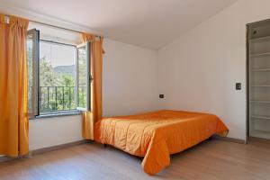 A bed or beds in a room at Villa Regno di Toscana