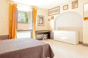A bed or beds in a room at Villa Regno di Toscana