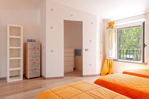 A bed or beds in a room at Villa Regno di Toscana