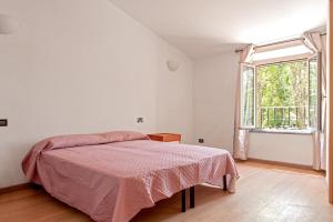 A bed or beds in a room at Villa Regno di Toscana
