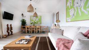 a living room with a couch and a table at Amaro Oasis by LovelyStay in Funchal