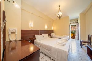 Postel nebo postele na pokoji v ubytování Lorenzo Hotel + 19 fotografií