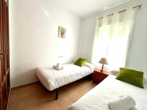 Posteľ alebo postele v izbe v ubytovaní Mirador de Doñana Nº8, Apartamentos Living Sur