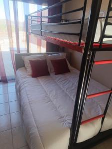 a bunk bed in a room with a bed on a ladder at Chambres chez l'habitant Coco2 in Boulazac +6 photos