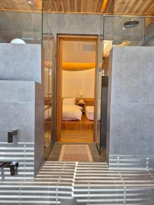 a view of a bedroom from the stairs of a room at Hanok Stay Seowa in Gyeongju