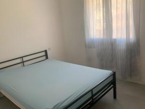 Ένα ή περισσότερα κρεβάτια σε δωμάτιο στο Appartement B