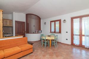 a living room with a couch and a table at Marelò in Vignola Mare