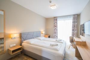 Postel nebo postele na pokoji v ubytování Hotel Diana