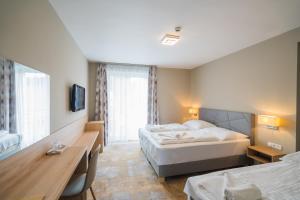 Postel nebo postele na pokoji v ubytování Hotel Diana