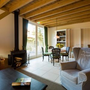 a living room with a couch and a table at 't Steumke in Enschede