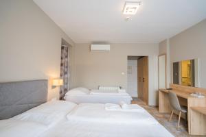 Postel nebo postele na pokoji v ubytování Hotel Diana