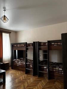 a room with two bunk beds in a room at Hotel okriba in Tqibuli +25 photos