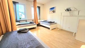 Katil atau katil-katil dalam bilik di Modern 3-Room Apartment with Winter Garden, Free Parking in Hagen - HA01