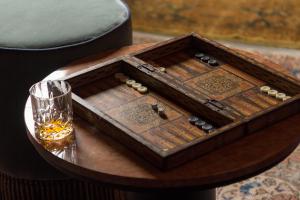a wooden box on a table with a glass at Palazzo Presta in Gallipoli