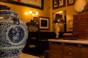 a blue and white vase sitting on top of a table at Palazzo Presta in Gallipoli +42 photos