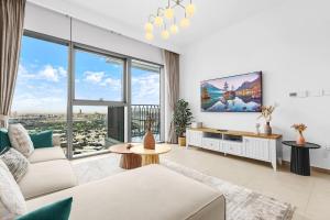 Et sittehjørne på Elegant 1BR in Heart of Dubai, Walk to Top Malls