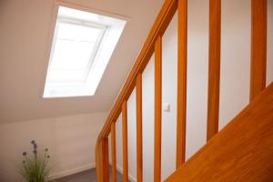 a skylight in a stairway with a window at Clipper in Norden +4 photos