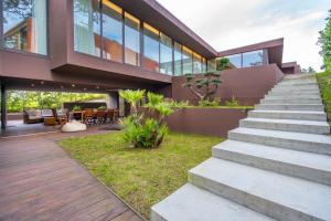 a house with a staircase leading up to it at Sun House in Cabedelo in Viana do Castelo