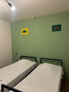 Postel nebo postele na pokoji v ubytování Sagule Hotel