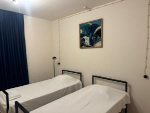 Postel nebo postele na pokoji v ubytování Sagule Hotel