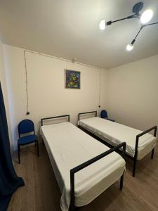 Postel nebo postele na pokoji v ubytování Sagule Hotel
