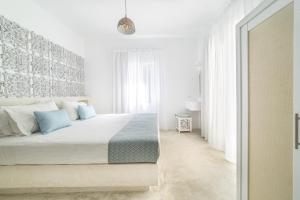 Ένα ή περισσότερα κρεβάτια σε δωμάτιο στο Votsalo Seaside