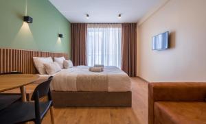 Postel nebo postele na pokoji v ubytování New Gudauri Apartments in Twins