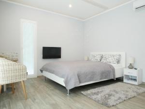 Postel nebo postele na pokoji v ubytování Apartmán Laura