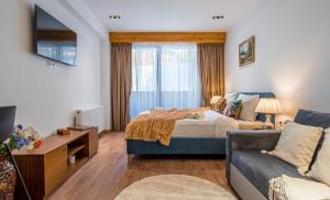 Postel nebo postele na pokoji v ubytování New Gudauri Apartments in Twins