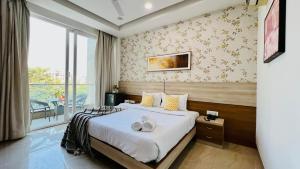 Postel nebo postele na pokoji v ubytování Olive Service Apartments - Near Medanta Medicity