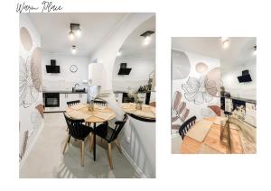 a kitchen and a dining room with a table and chairs at Warm Place in Tomaszów Mazowiecki