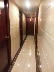 a hallway of a elevator with a door and a room at Sun Shine Guest House in Hong Kong