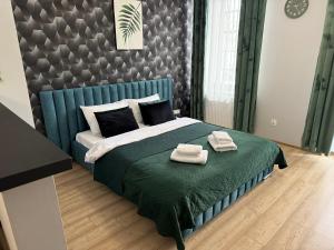 Posteľ alebo postele v izbe v ubytovaní H-T-L Apartamenty Junior