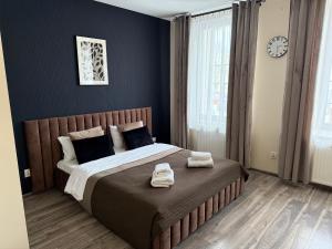 Posteľ alebo postele v izbe v ubytovaní H-T-L Apartamenty Junior