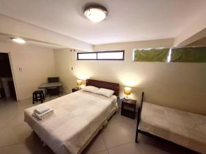 Cama ou camas em um quarto em Hostal Anpaymi Atacama