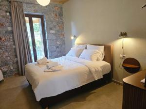 Postel nebo postele na pokoji v ubytování Aeriko Guest House