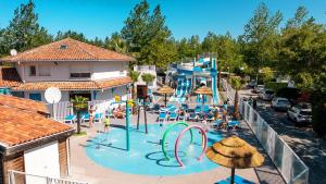 an aerial view of a water park with a slide at Camping Le Domaine de la Marina in Messanges